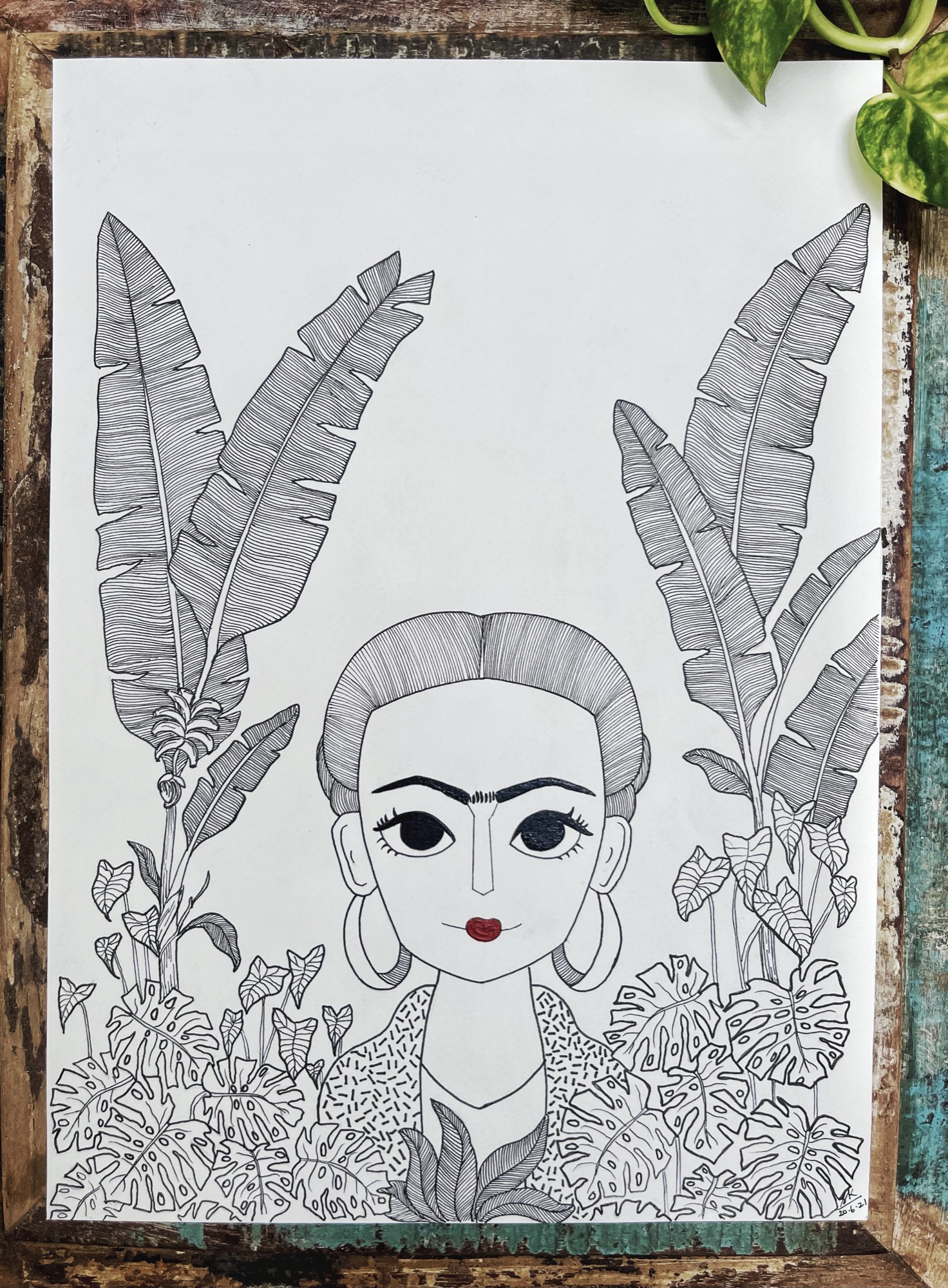 Pen illustration of a woman's face emerging from banana leaves and monstera plants